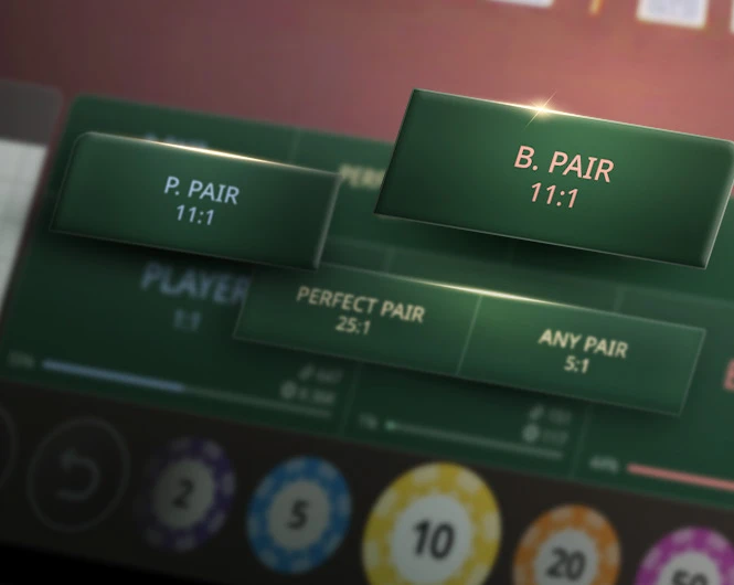 Close-up image of a gaming table with betting options displayed, including 'P. PAIR' at 11:1, 'B. PAIR' at 11:1, 'PERFECT PAIR' at 7:2, and 'ANY PAIR' at 7:2, with colorful chips in the background.